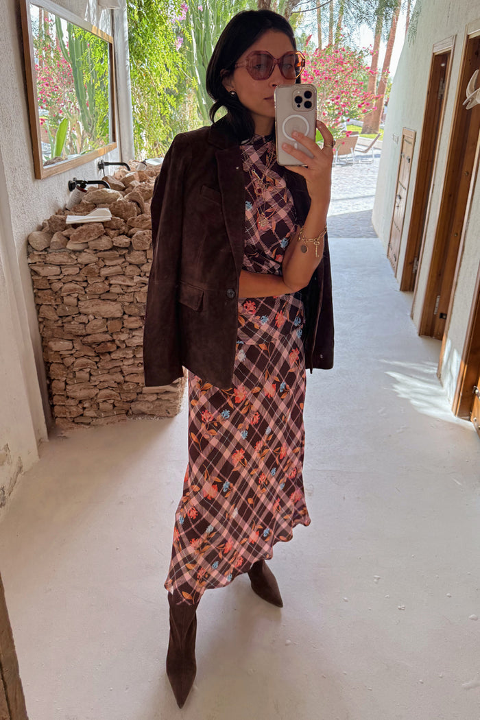 Chocolate brown Check Floral Lottie Skirt co-ord styled with a suede jacket in a mirror selfie.