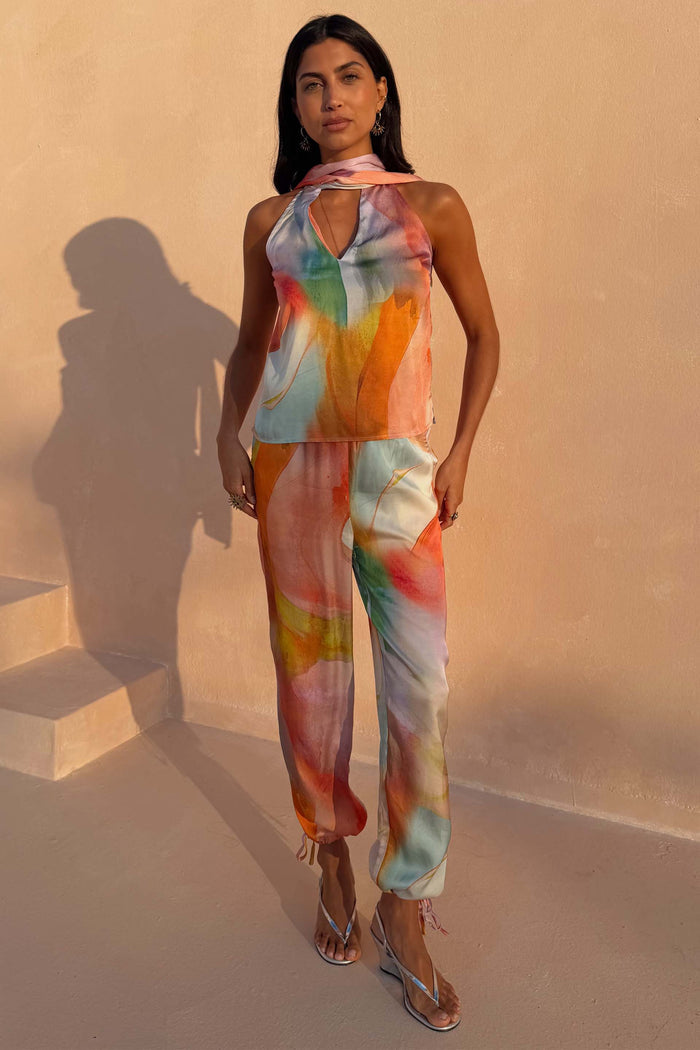 Abstract Naomi Trousers in a multicoloured print featuring a balloon leg shape and adjustable ankle ties.