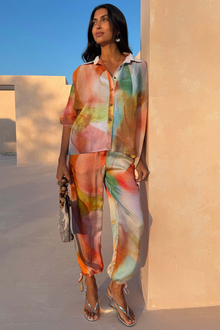 Abstract Naomi Trousers with a multicoloured print, balloon leg and ankle ties, styled as a co-ord.
