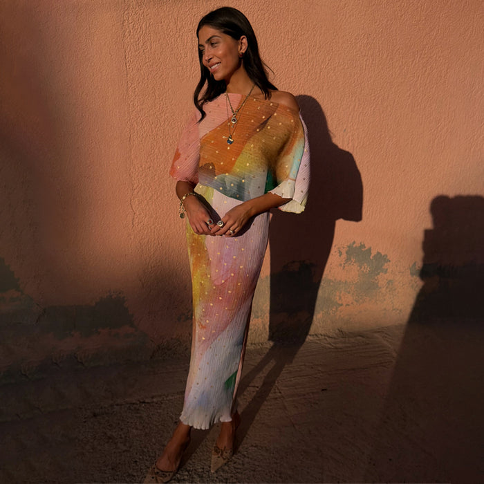 Abstract Tilly Midaxi Dress with a vibrant paintbrush print and metallic gold flecks on a plissé fabric.