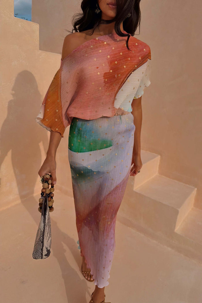 Abstract Tilly Midaxi Dress in multicoloured plisse with metallic gold flecks, worn off-the-shoulder on a model.