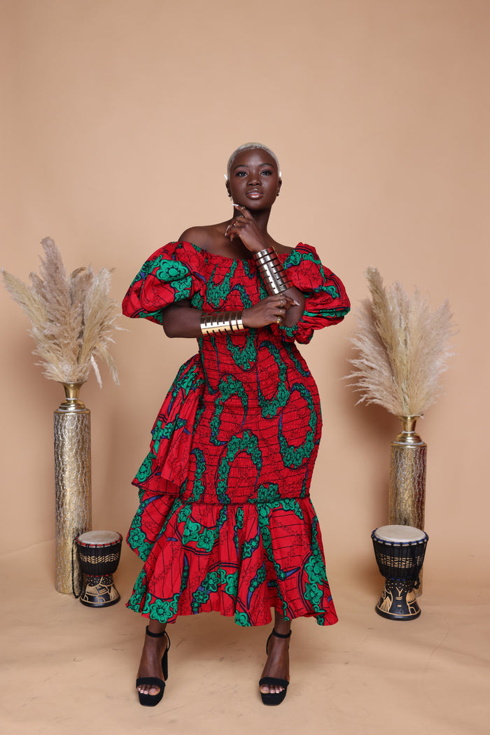African print smoked body dress with ruffles on the side.