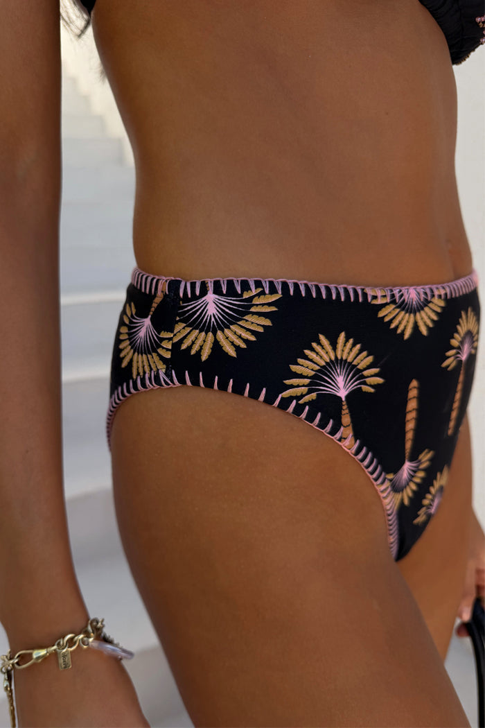 Black high leg bikini brief with palm embroidery and a contrast pink crochet stitch trim.