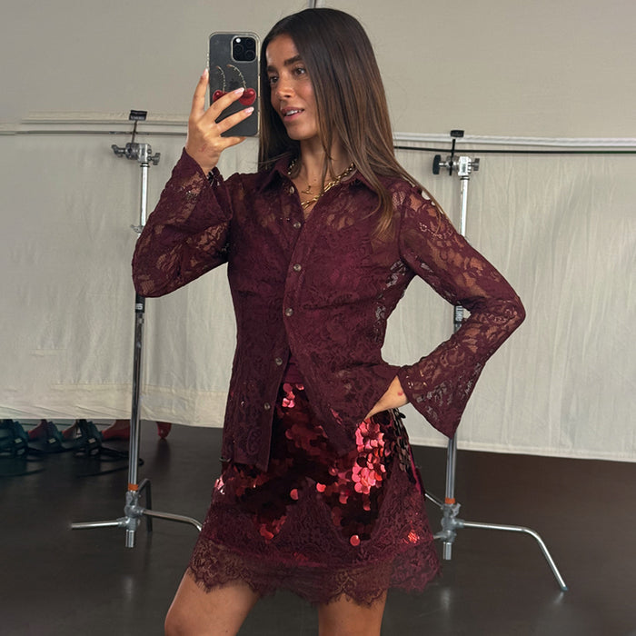Burgundy Lace Shirt in delicate lace with flared cuffs, styled with a sequin mini skirt for a dopamine dressing look.