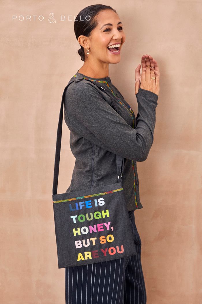 Charcoal Life is Tough Honey Drainage Bag featuring a rainbow slogan print and a comfortable shoulder strap.
