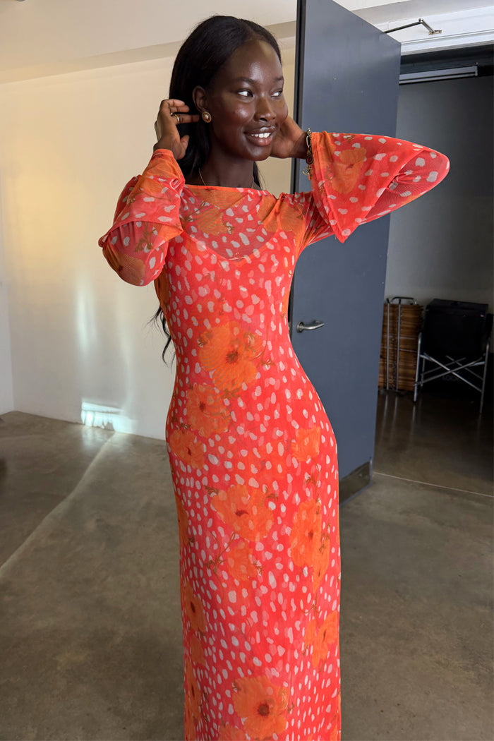 Coral Fawn Poppy Aria Dress featuring an orange poppy and white fawn print on a coral mesh fabric with flared sleeves.