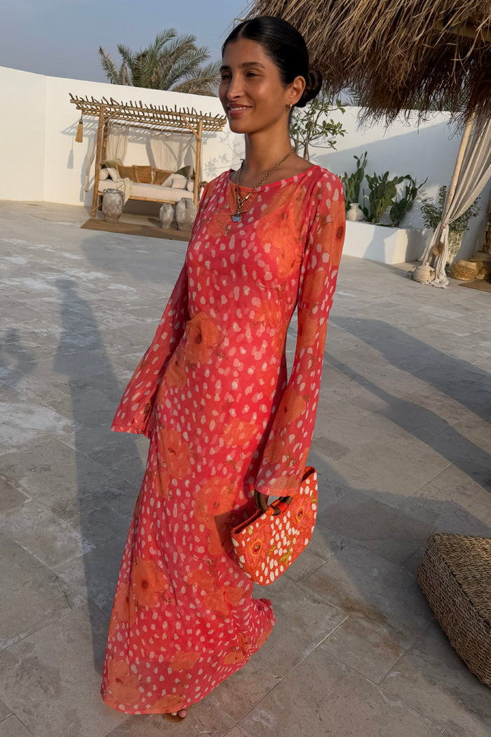 Coral Fawn Poppy Aria Dress in pink mesh with floral motifs and flared sleeves, styled for a summer wedding.