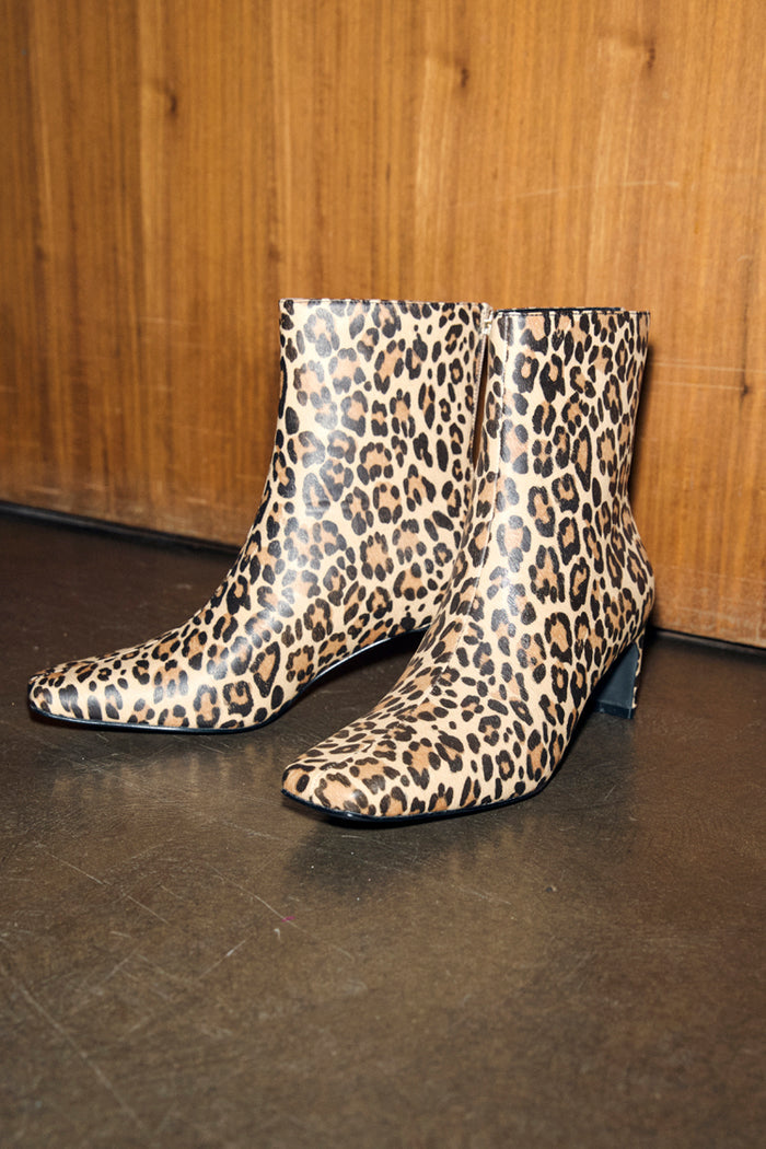 Leopard Heel Boots with a square toe and block heel, featuring animal print as a neutral wardrobe staple.