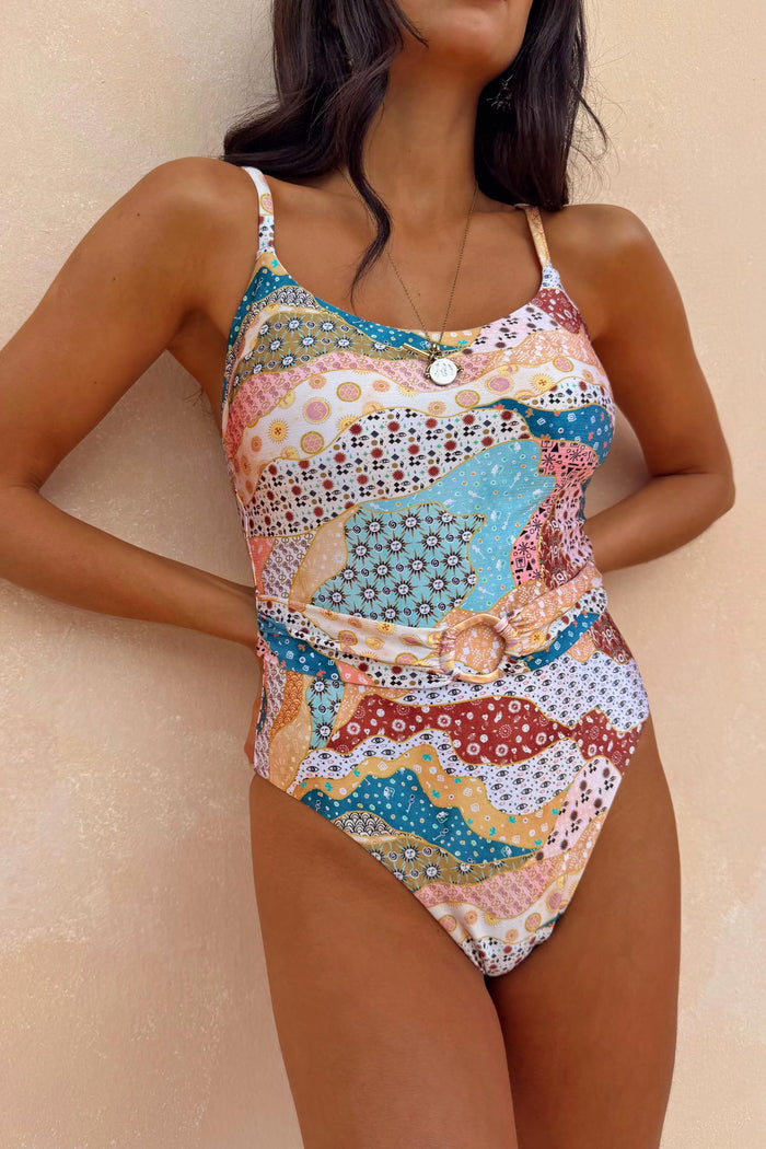 Morocco Swimsuit in a multi-coloured patchwork print with a scoop neckline and a belted waist with ring detail.