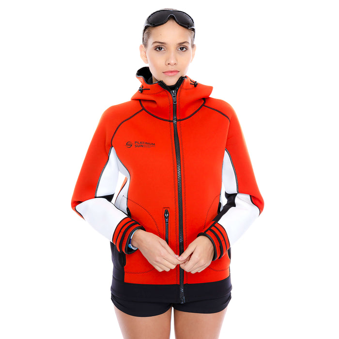 Woman wearing the red Platinum Sun neoprene jacket hoodie zipped up, with sunglasses and hood down