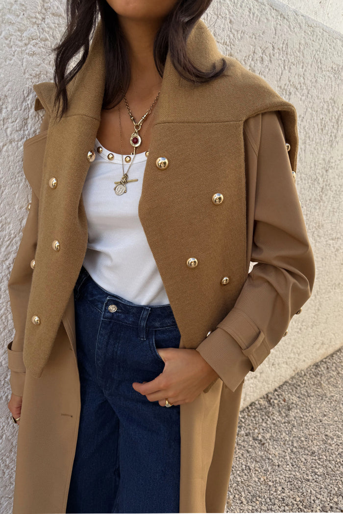 Tan Stud Evie Knit Jumper with gold stud detailing draped over a trench coat for a multi-wear look.